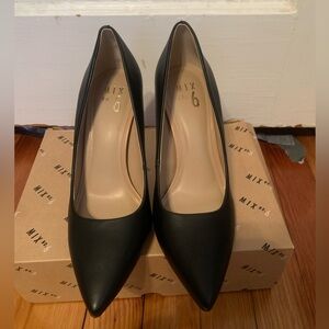 A pair of black heels